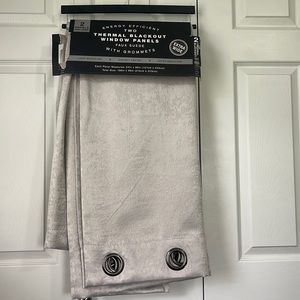 Set of 2 brand new black out curtains